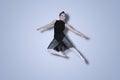 Young ballerina performs elegant jumps on studio Royalty Free Stock Photo