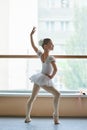 Young ballerina standing in ballet position. Royalty Free Stock Photo