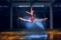 Young ballerina with water splash in high speed sync