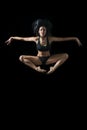 Young ballet dancer dansing on black background Royalty Free Stock Photo