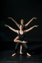 Young ballet dancer dansing on black background Royalty Free Stock Photo