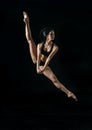 Young ballet dancer dansing on white background