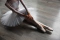 Young ballet dancer girl posing at studio sitting on floor Royalty Free Stock Photo