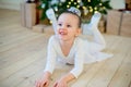 Young ballet dancer lying near Christmas tree Royalty Free Stock Photo