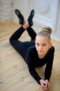 Young ballet dancer lying near the wall Royalty Free Stock Photo