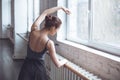 Young ballet dancer practice movement hand up in studio active lifestyle