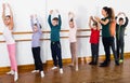 Young ballet dancers exercising in ballroom Royalty Free Stock Photo