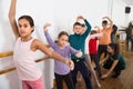 Young ballet dancers exercising in ballroom Royalty Free Stock Photo