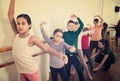 Young ballet dancers exercising in ballroom Royalty Free Stock Photo