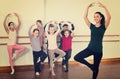 Young ballet dancers exercising in ballroom Royalty Free Stock Photo