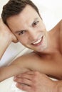 Young Bare Chested Man Relaxing On Bed Royalty Free Stock Photo