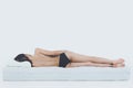 Young Bare Woman Lying on Orthopedic Mattress Royalty Free Stock Photo