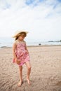 Young barefoot girl at beach