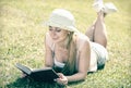 Young barefoot woman lying on green grass Royalty Free Stock Photo