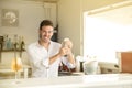 Young barman preparing cocktail in beach bar Royalty Free Stock Photo