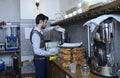 Young barman works with blender at his workplace, Crimean Tartar restaurant
