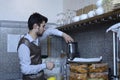 Young barman works with blender at his workplace, Crimean Tartar restaurant