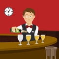 Young bartender pours champagne in a wineglass in bar Royalty Free Stock Photo