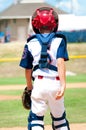 Young baseball catcher during game. Royalty Free Stock Photo