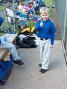 Young baseball player giving the thumbs-up.