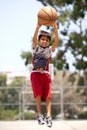 Young basketball player jumping high