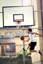 Young basketball player playing with energy