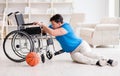 Young basketball player on wheelchair recovering from injury Royalty Free Stock Photo