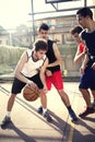 Young basketball players playing with energy Royalty Free Stock Photo