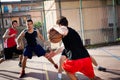 Young basketball players playing with energy Royalty Free Stock Photo