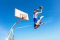 Young Basketball street player making slam dunk Royalty Free Stock Photo