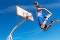 Young Basketball street player making slam dunk Royalty Free Stock Photo