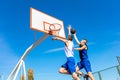 Young Basketball street player making slam dunk Royalty Free Stock Photo