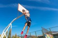 Young Basketball street player making slam dunk Royalty Free Stock Photo