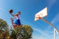 Young Basketball street player making slam dunk Royalty Free Stock Photo