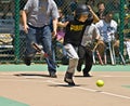 Young Batter Running to First Base Royalty Free Stock Photo