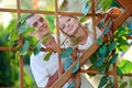 Young bautiful couple at the wooden lattice Royalty Free Stock Photo