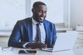 Young Beard Afro-american Man Working with Laptop. Royalty Free Stock Photo