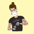 Young bearded barista in a medical mask prepares coffee