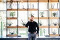 Young bearded business man in office talking at mobile phone in modern office Royalty Free Stock Photo