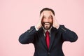 Aged bearded businessman acting surprised with hands on head wide opened mouth isolated on pastel pink wall. Face happy emotion.