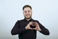 Happy Male Smiles, Makes A Heart Shape With His Hands. The Concept Love Royalty Free Stock Photo