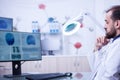 Young bearded doctor doing a brain examination in a modern hospital Royalty Free Stock Photo