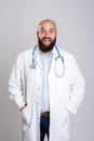 Young bearded doctor looking amazed