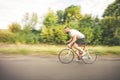 Young bearded hipster driving bicycle