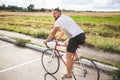 Young bearded hipster driving bicycle