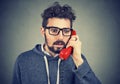 Worried man receiving bad news on phone Royalty Free Stock Photo