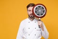 Young bearded male chef cook or baker man in white uniform shirt posing isolated on yellow wall background studio Royalty Free Stock Photo