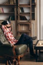 Young bearded man enjoying virtual reality glasses