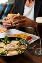 A young bearded man having lunch in an urban pub Royalty Free Stock Photo