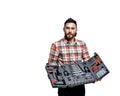 The young bearded man hold a repair tools Royalty Free Stock Photo